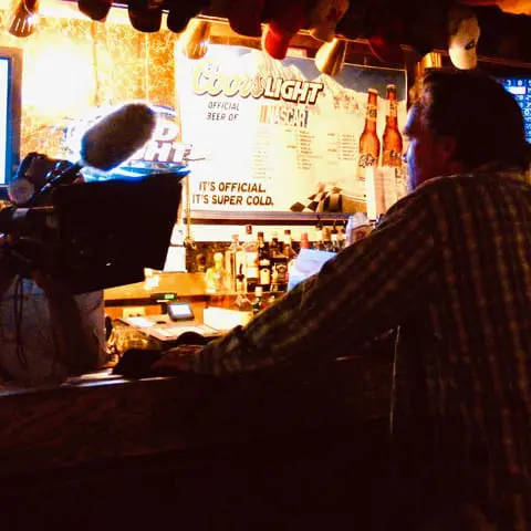 Director Jamison in character as Marcus Bryant filming a scene on location in Bellevue Nebraska